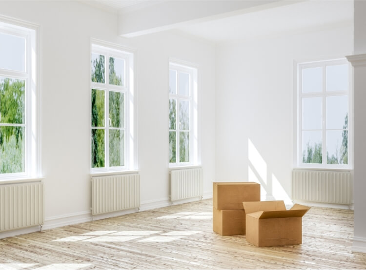 Clean and empty apartment with moving boxes